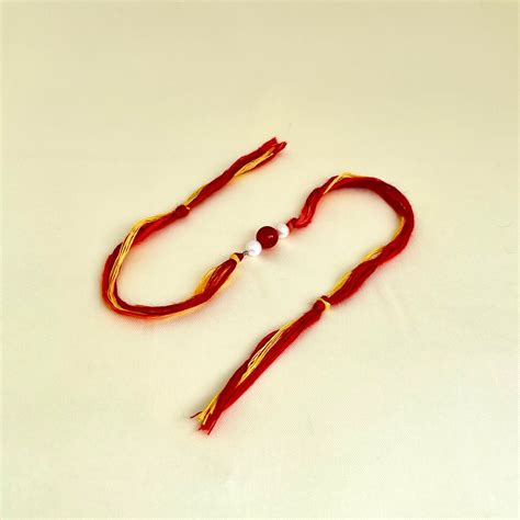 Handcrafted Carnelian Pearl Beaded Rakhi - CherishBox – CherishBox ...