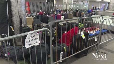 Lost luggage remains at Denver airport as airline chaos continues ...