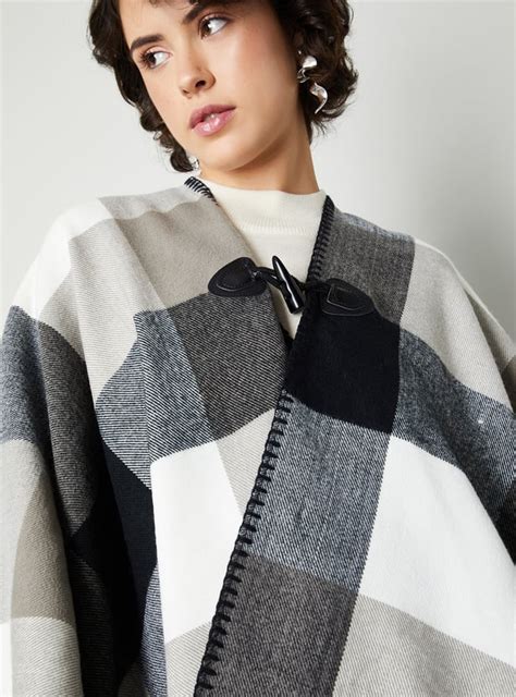 Buy Women Checked Poncho with Embroidered Trim Online at just Rs. 1499. ...