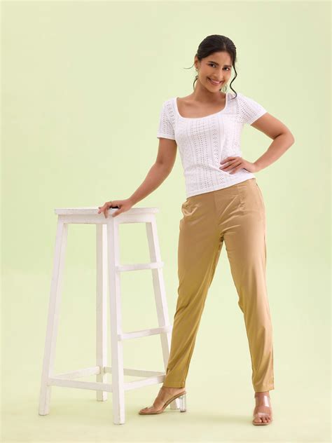 Women Solid Medium Gold Mid Rise Shiny Pants