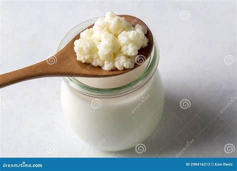 Kefir Fermented Milk Drink with Kefir Grains. Homemade Kefir Stands in a Glass, Next To Kefir ...