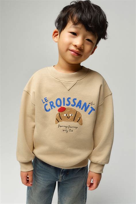 Printed crew-neck sweatshirt - Beige/Le Croissant - Kids | H&M IN