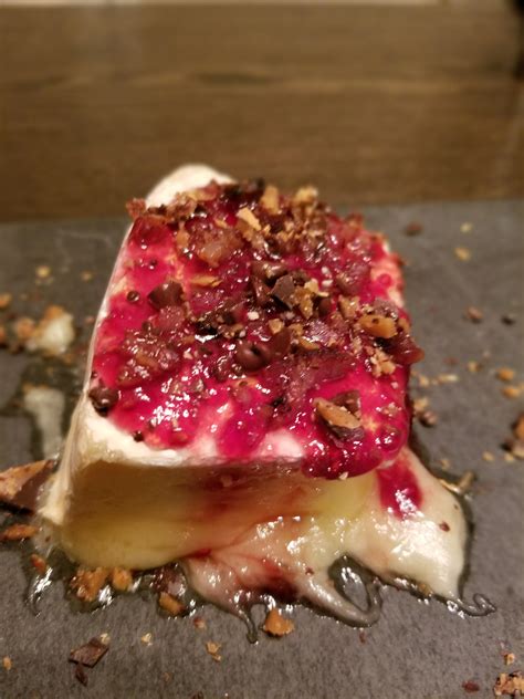 Baked french brie with raspberry preserves and sprinkled with english ...