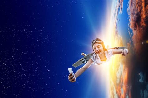 Joyful girl flying with self-made paper wing in space. mixed media ...