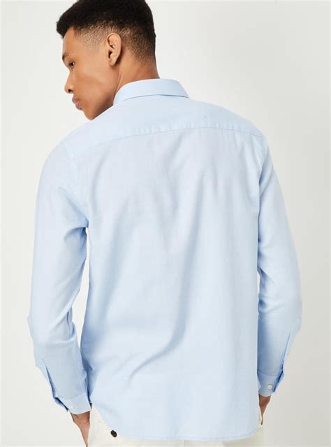 Buy Men Regular Fit Solid Shirt Online at just Rs. 999.0 ...