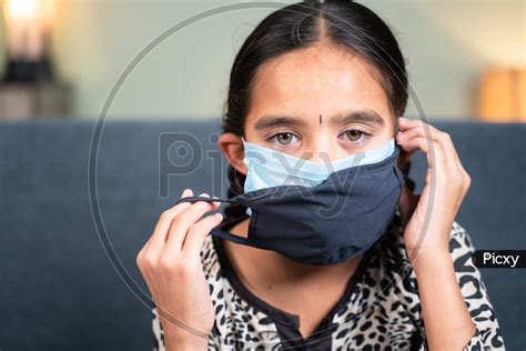 Image of Young Little Girl Wearing Double Or Two Face Mask To Protect ...