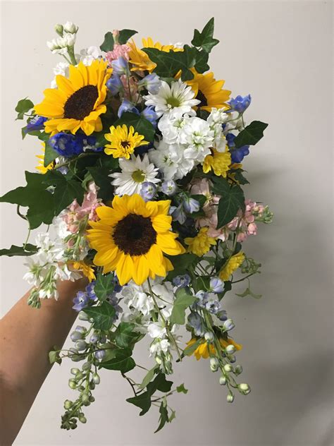 Cascading sunflower bridal bouquet with pops of your “Something Blue” # ...