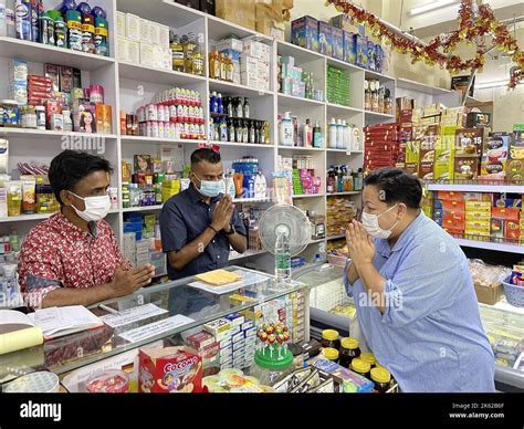 Aftab Uddin Manik, owner of Jordan Mart (left) greets customers and ...