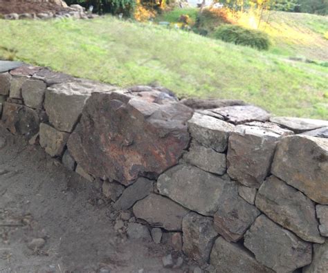 How to build a natural dry stacked stone free standing or retaining ...