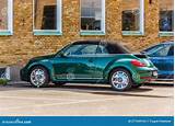 Dark Green Metallic VW Beetle Cab Parked by a Brick Building ...