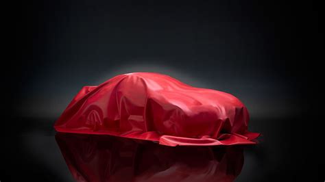 Car under red cloth awaiting reveal | Red, Clothes, Automotive