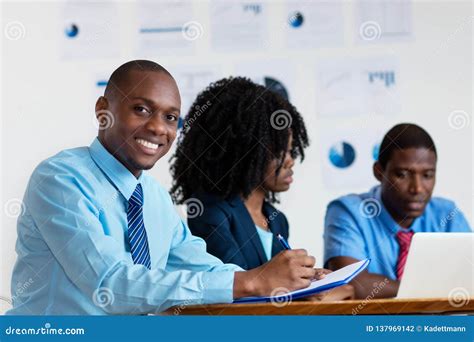 Happy African American Financial Advisor with Business Team Stock Photo ...