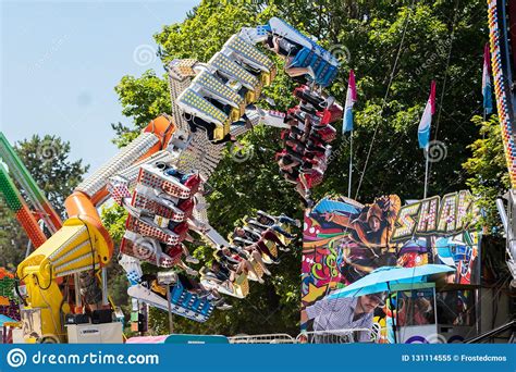 Claw Roller Coaster Ride with Screaming People at the Amusement Park ...