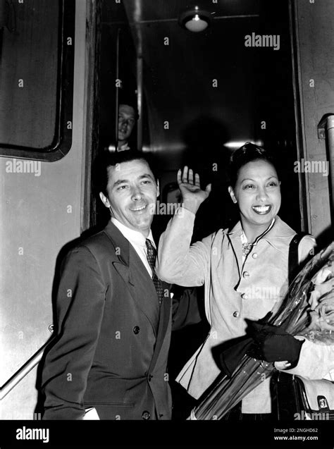 Josephine Baker smiles and waves as she and her husband, French ...