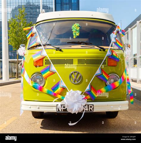 vintage green Type 2 volkswagen bus kombi with rainbow flags bunting at ...