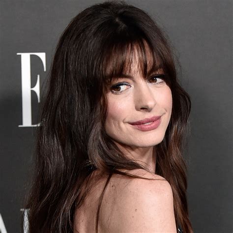 Anne Hathaway Just Wore a Corset Puffer Coat Over a Sexy Winter LBD—See ...