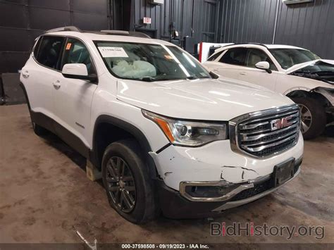 Report 1GKKNULS2KZ297970 GMC ACADIA 2019 White Gasoline - price and damage history