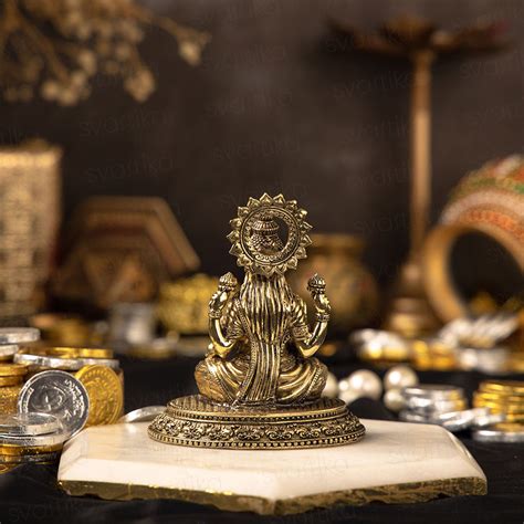 Seated Four-Armed Lakshmi Brass Murti for Home | 4 Inch