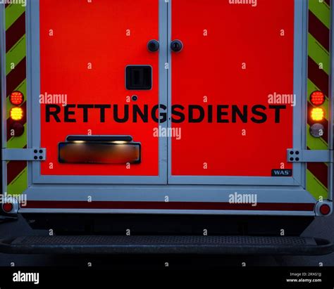 Rear view of german ambulance with the word rescue service in german written on its doors Stock ...