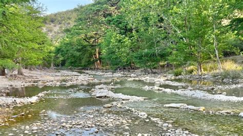 Frio River is at 0 flow in Concan. Images show how low the water is.