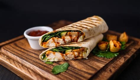 Juicy grilled chicken wrap with fresh veggies and tangy sauce tasty ...