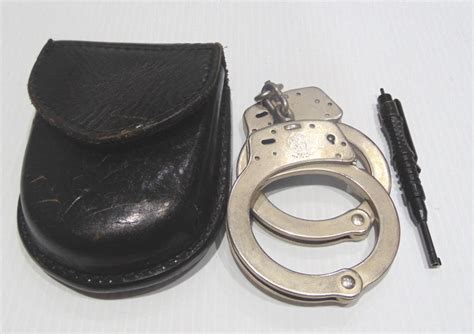 Lot - Smith & Wesson Handcuffs,Key && Belt Pouch