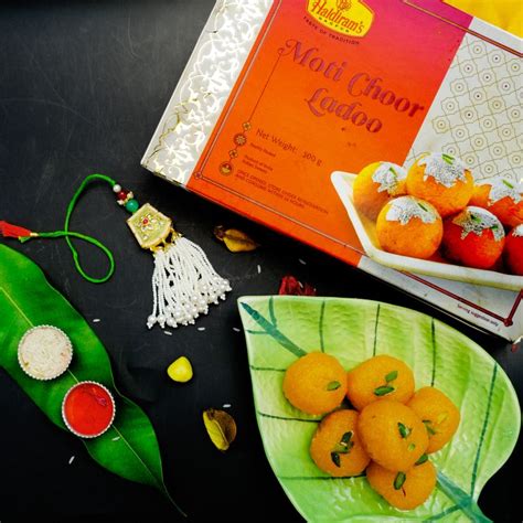 Send Royal Splendor Kundan and Moti Rakhi with Motichoor Laddu Online