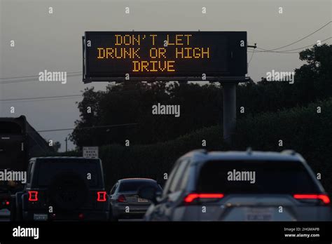 A Caltrans message board with the words "Don't let drunk or high drive ...