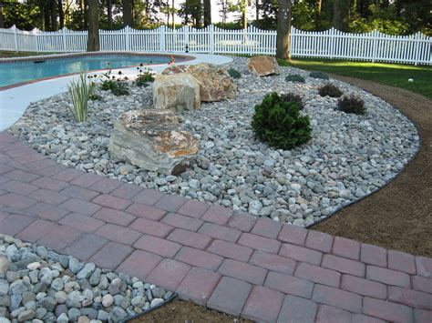 River Stones & Boulders with Poolside Plantings | Landscaping with ...
