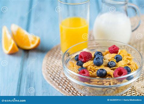 Healthy Breakfast Concept - Cereals with Berries, Orange Juice, Orange ...