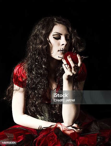 Strange Scary Girl With Mouth Sewn Shut Eating Nailed Apple Stock Photo ...