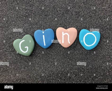 Gino, masculine italian name with colored heart stones over black ...
