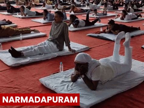 mp leaders stretch bend pose yoga day cm pawan muktasana vijay shah ...