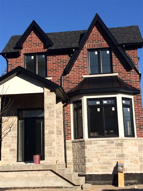 Red Brick Black Gutters On Brick House