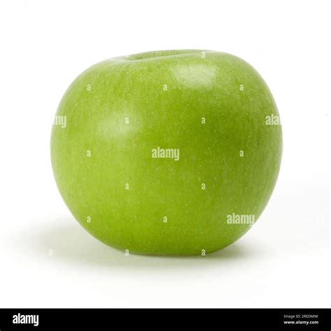 A clean colourful whole green Granny Smith apple fruit on a white ...