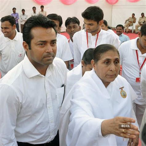 Subhash Ghai gestures as he arrives on the stage during Brahma Kumaris ...