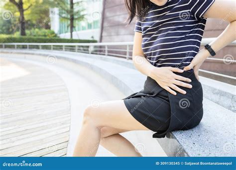 Woman Holding the Left Side of Her Waist in Pain,painful in the Flank between Ribs and Hip ...