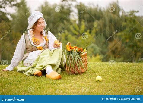 The Peasant Woman Stopped at a Picnic. Looks at the Pear Stock Image ...