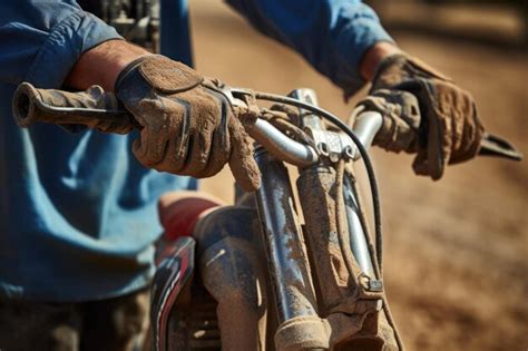 Closeup of a motocross riders gloved hand gripping handlebars | Premium ...