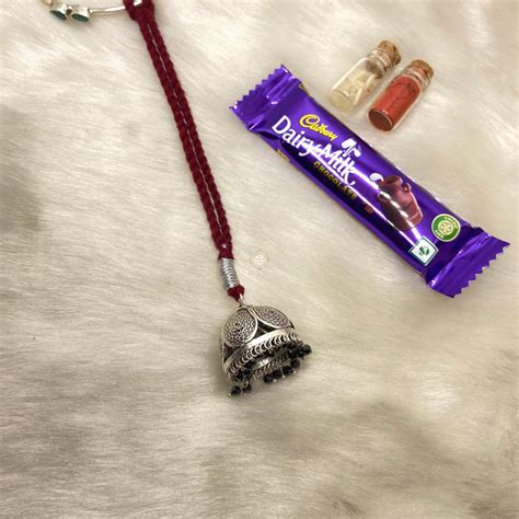 Sterling Silver Lumba Rakhi (Maroon) – The Chandi Studio