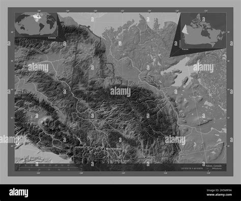 Yukon, territory of Canada. Bilevel elevation map with lakes and rivers. Locations and names of ...