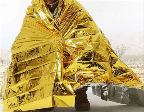 Human Body Hypothermia Lifesaving Emergency Blanket In Outdoor Field ...