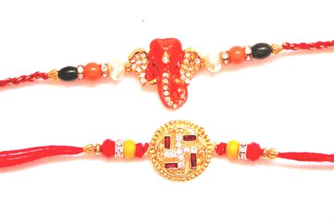 Combo rakhi pack of Studded Ganesha and Swastik with gold dial ...