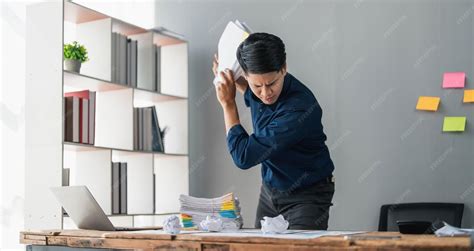 Mad crazy man employee sitting in office workplace with sticky notes ...