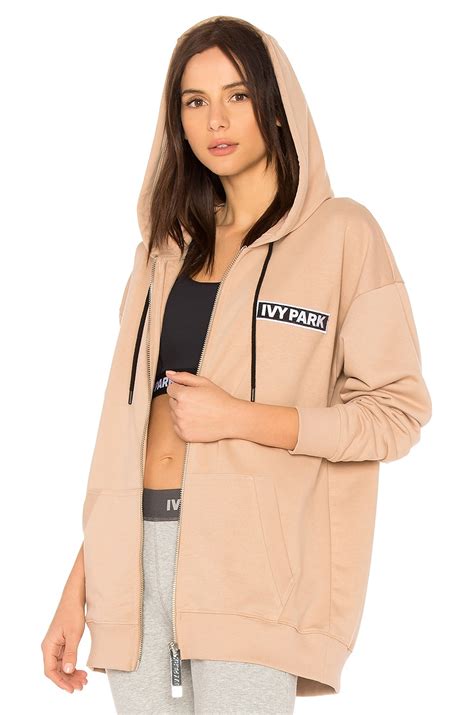 IVY PARK Badge Logo Zip Up Hoodie in Sand | REVOLVE