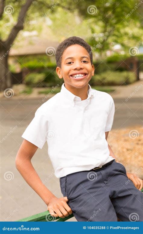 Cute Happy Black Boy Sitting on Gate Stock Photo - Image of handsome ...