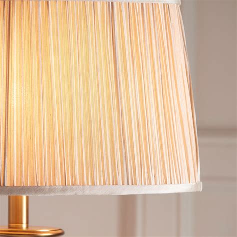 Polina antique brass floor light teamed with a beige organza effect shade