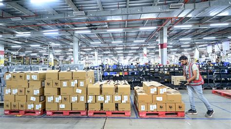 An Amazon employee working at a fulfilment centre