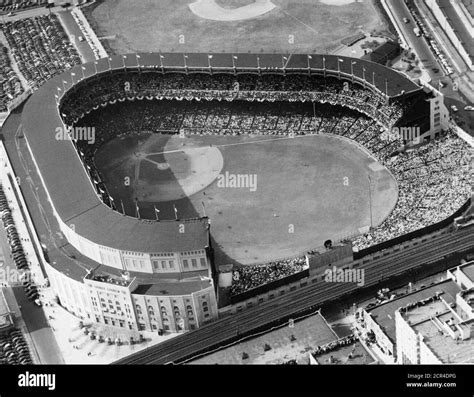 Aerial view of Yankee Stadium with a capacity-filled audience during a baseball game, New York ...