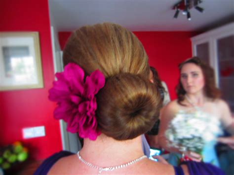 Sleek sophisticated Bun using a hair donut | Hair donut, Bun hairstyles ...